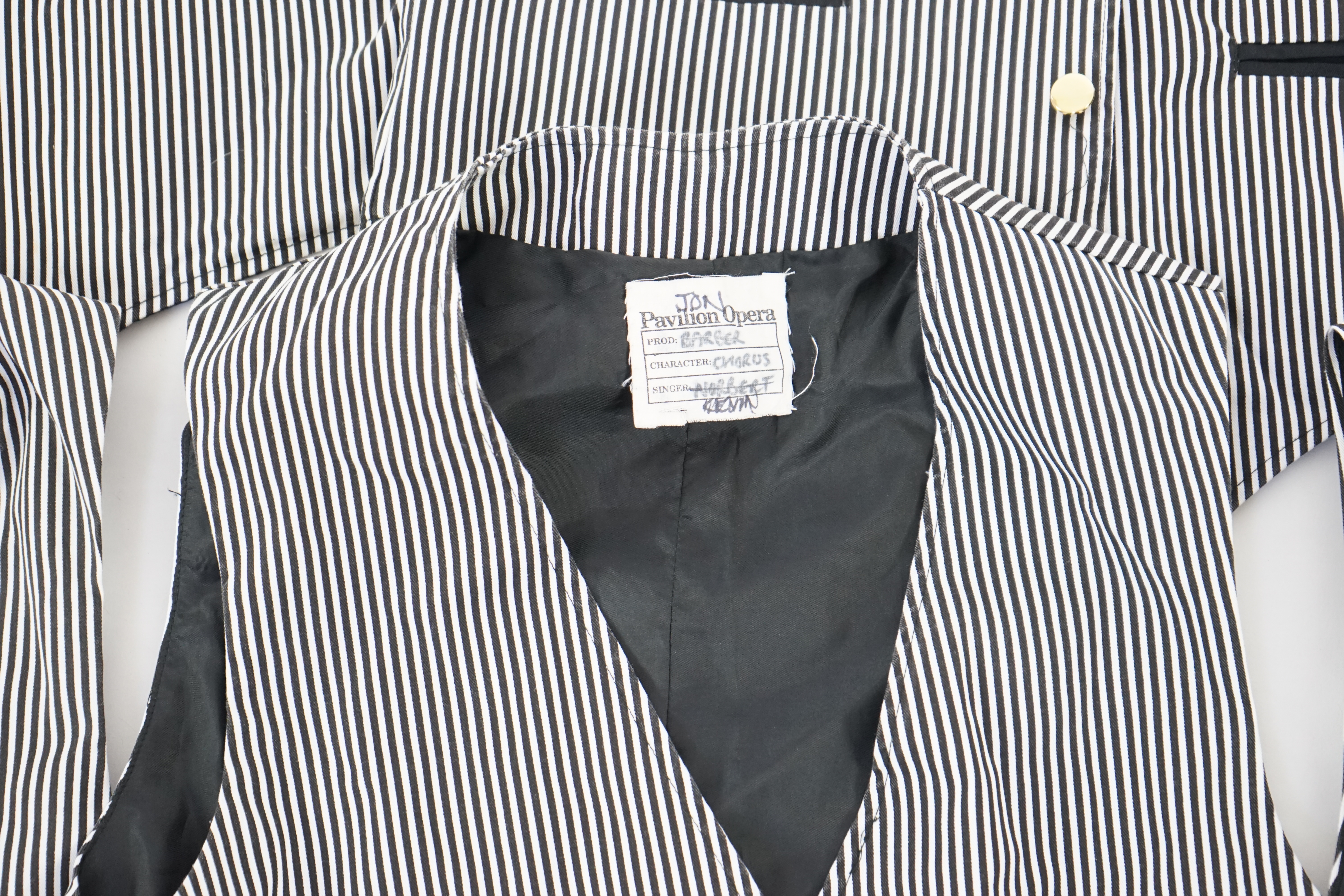 Nine men's black and white striped waistcoats (various sizes) some marked Pavilion Opera 'The Barber of Seville'